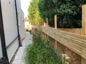 Modern Garden Makeover with Flower Planters, Patio and Batten Fence in Redhill